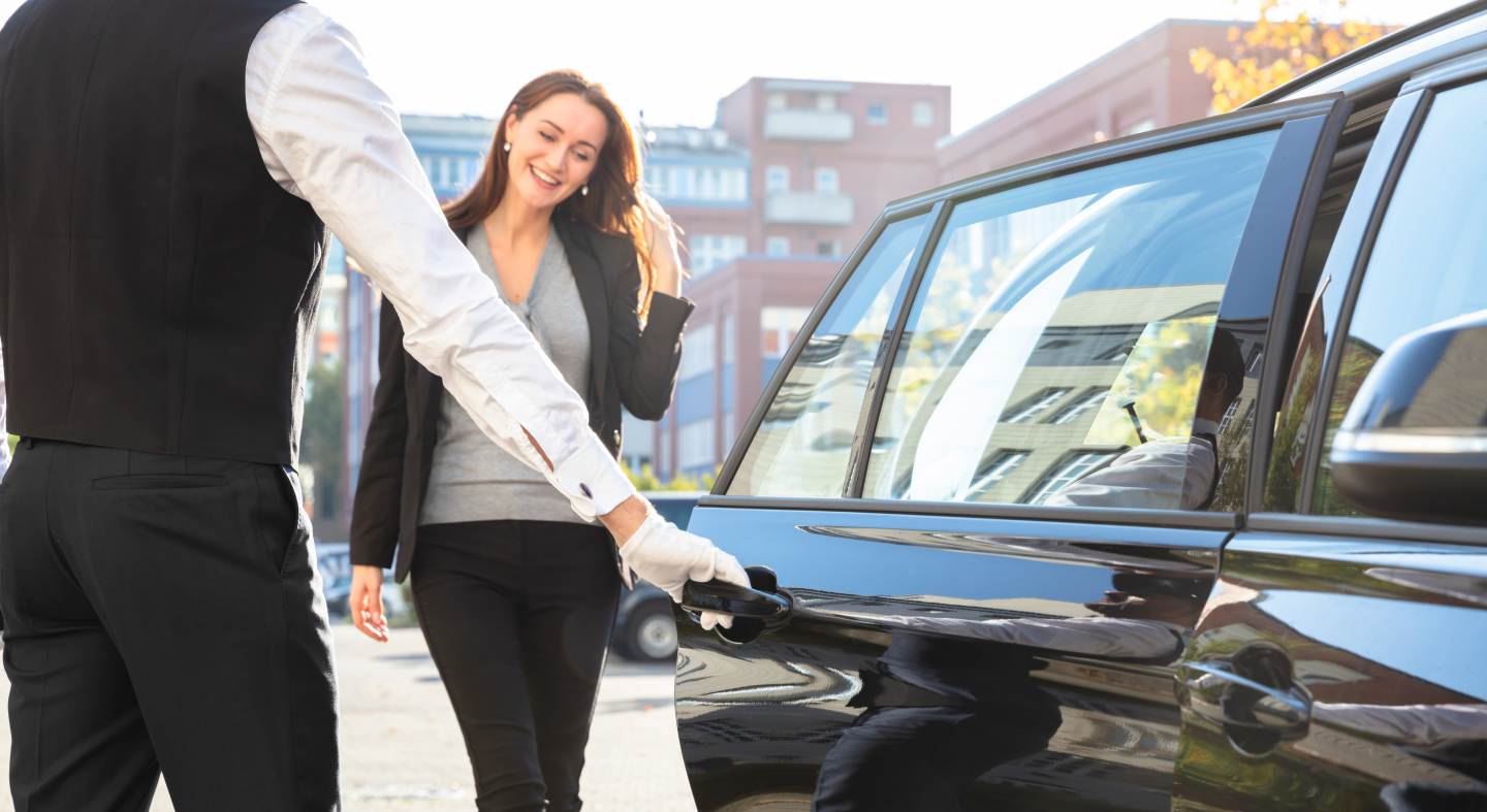 A personal driver opening the door