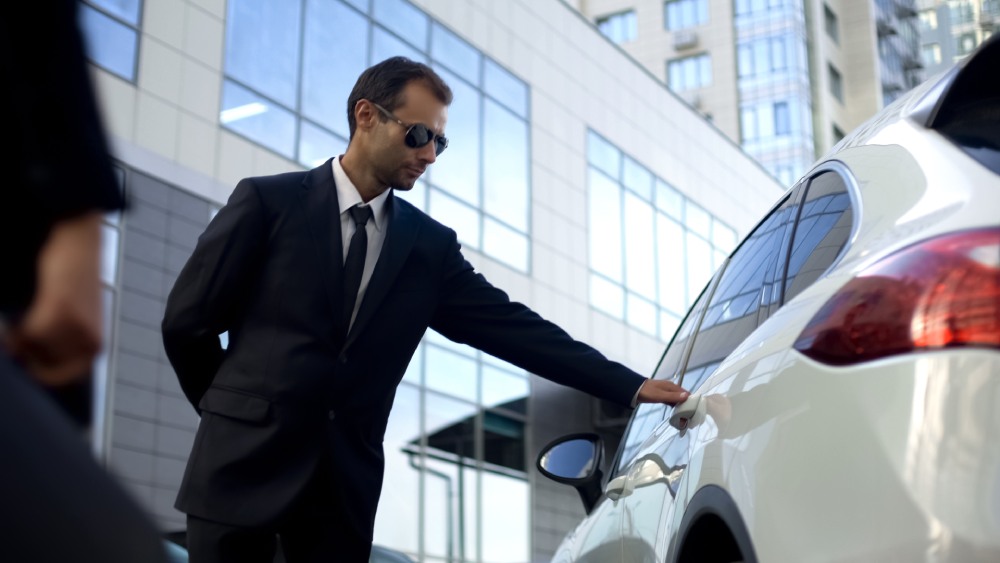 Personal driver meeting and opening car door